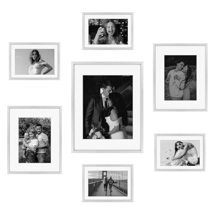 Frametory 7 Pack Aluminum Picture Frame with Mat for Gallery Wall, Silver | Set includes one 11x14, two 8x10, four 5x7 frames with glass fronts, removable mats, and built-in hangers for wall mounting - color: Silver