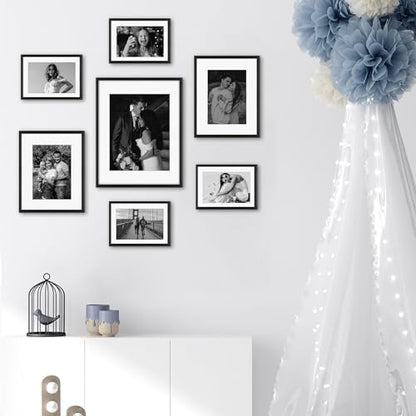 Frametory 7 Pack Aluminum Picture Frame with Mat for Gallery Wall, Black | Set includes one 11x14, two 8x10, four 5x7 frames with glass fronts, removable mats, and built-in hangers for wall mounting - color: Black