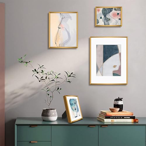 Frametory 7 Pack Aluminum Picture Frame with Mat for Gallery Wall, Bronze | Set includes one 11x14, two 8x10, four 5x7 frames with glass fronts, removable mats, and built-in hangers for wall mounting - color: Bronze