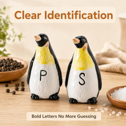 Ceramic Penguin Salt and Pepper Shakers Set Refillable Seasoning Dispensers | Set of 2 hand-painted ceramic penguin salt and pepper shakers with clear "S" and "P" labels and silicone stoppers.