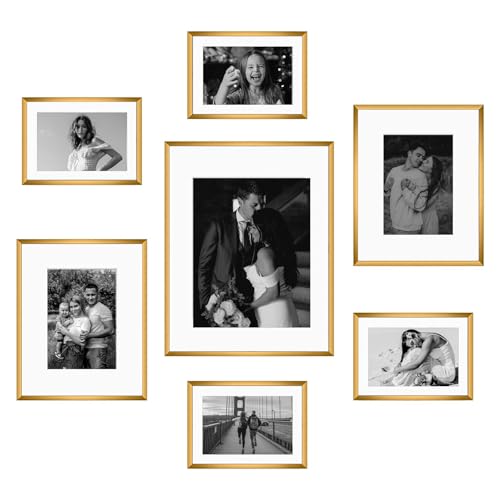 Frametory 7 Pack Aluminum Picture Frame with Mat for Gallery Wall, Bronze | Set includes one 11x14, two 8x10, four 5x7 frames with glass fronts, removable mats, and built-in hangers for wall mounting - color: Bronze