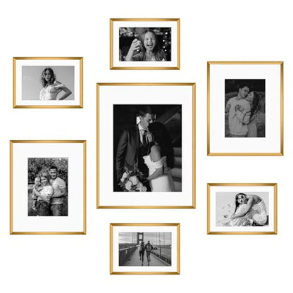 Frametory 7 Pack Aluminum Picture Frame with Mat for Gallery Wall, Bronze | Set includes one 11x14, two 8x10, four 5x7 frames with glass fronts, removable mats, and built-in hangers for wall mounting - color: Bronze