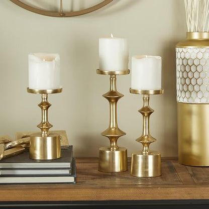 CosmoLiving by Cosmopolitan Aluminum Metal Decorative Candle Holder Pillar Candle Stand, Set of 3 Candlestick Holder 11", 9", 7" H, Gold - color: Gold