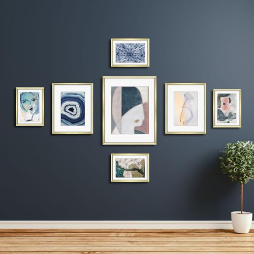 Frametory 7 Pack Aluminum Picture Frame with Mat for Gallery Wall, Gold | Set includes one 11x14, two 8x10, four 5x7 frames with glass fronts, removable mats, and built-in hangers for wall mounting - color: Gold