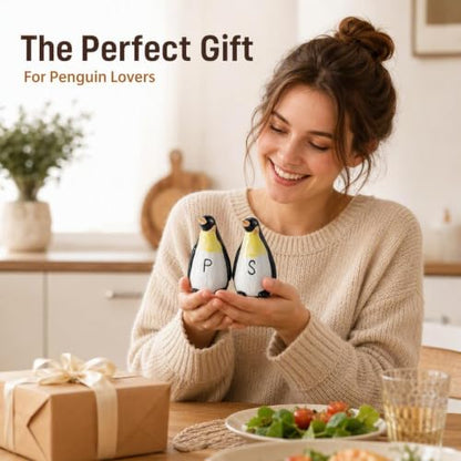 Ceramic Penguin Salt and Pepper Shakers Set Refillable Seasoning Dispensers | Set of 2 hand-painted ceramic penguin salt and pepper shakers with clear "S" and "P" labels and silicone stoppers.