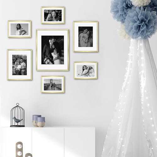 Frametory 7 Pack Aluminum Picture Frame with Mat for Gallery Wall, Gold | Set includes one 11x14, two 8x10, four 5x7 frames with glass fronts, removable mats, and built-in hangers for wall mounting - color: Gold