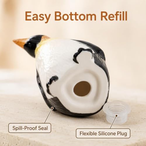 Ceramic Penguin Salt and Pepper Shakers Set Refillable Seasoning Dispensers | Set of 2 hand-painted ceramic penguin salt and pepper shakers with clear "S" and "P" labels and silicone stoppers.