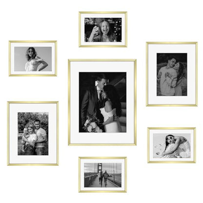 Frametory 7 Pack Aluminum Picture Frame with Mat for Gallery Wall, Gold | Set includes one 11x14, two 8x10, four 5x7 frames with glass fronts, removable mats, and built-in hangers for wall mounting - color: Gold