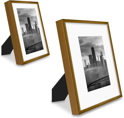 Frametory 7 Pack Aluminum Picture Frame with Mat for Gallery Wall, Bronze | Set includes one 11x14, two 8x10, four 5x7 frames with glass fronts, removable mats, and built-in hangers for wall mounting - color: Bronze