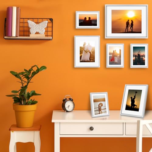 Frametory 7 Pack Aluminum Picture Frame with Mat for Gallery Wall, Silver | Set includes one 11x14, two 8x10, four 5x7 frames with glass fronts, removable mats, and built-in hangers for wall mounting - color: Silver