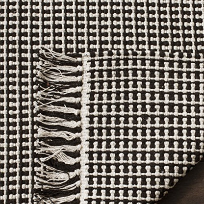 SAFAVIEH Montauk Collection Accent Rug - 3' x 5', Ivory & Black, Handmade Flat Weave Boho Farmhouse Cotton Tassel Fringe, Ideal for High Traffic Areas in Entryway, Living Room, Bedroom (MTK340D)
